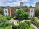 An aerial view of the property showcasing building and surrounding mature trees at 2965 Pharr Court South Nw # 102, Atlanta, GA 30305