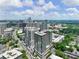 Stunning aerial view of the building's architecture and surroundings, blending urban and natural landscapes at 2965 Pharr Court South Nw # 102, Atlanta, GA 30305