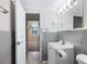 Stylish bathroom featuring a modern sink and a doorway that leads into a bedroom at 2965 Pharr Court South Nw # 102, Atlanta, GA 30305