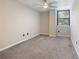Neutral bedroom showcasing a window, carpeted floors, and modern fixtures at 2965 Pharr Court South Nw # 102, Atlanta, GA 30305