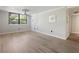 Bright room with modern fan and stylish floors, perfect for relaxing or entertaining at 2965 Pharr Court South Nw # 102, Atlanta, GA 30305