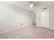 Bright bedroom with carpet, featuring a ceiling fan and access to a bathroom at 2965 Pharr Court South Nw # 102, Atlanta, GA 30305