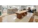 Communal dining area with large table, adjacent kitchen, and comfortable seating at 2965 Pharr Court South Nw # 102, Atlanta, GA 30305