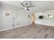 Bright living room with modern fan and stylish floors, perfect for relaxing or entertaining at 2965 Pharr Court South Nw # 102, Atlanta, GA 30305