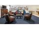 Cozy community living room with bookshelves, comfortable seating, and ample natural light at 2965 Pharr Court South Nw # 102, Atlanta, GA 30305