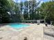 Enjoy a refreshing swim in this community pool surrounded by lush greenery and lounge seating at 2965 Pharr Court South Nw # 102, Atlanta, GA 30305