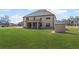 Expansive backyard featuring a well-maintained lawn, a screened in porch and a storage shed at 701 Cupcake Ct, Mcdonough, GA 30252