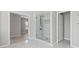Elegant bathroom with a tiled shower and a glass door at 701 Cupcake Ct, Mcdonough, GA 30252