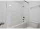 A well-lit bathroom features white subway tiles and tub at 701 Cupcake Ct, Mcdonough, GA 30252