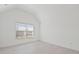 This bedroom has a bright window and light wood floors at 701 Cupcake Ct, Mcdonough, GA 30252