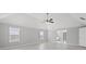 Bright bedroom with large windows and a ceiling fan at 701 Cupcake Ct, Mcdonough, GA 30252