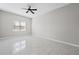 Bright bedroom with neutral walls, tile floors and a ceiling fan at 701 Cupcake Ct, Mcdonough, GA 30252