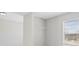 Empty closet with window and wall mounted clothes hanger at 701 Cupcake Ct, Mcdonough, GA 30252