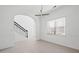 Elegant dining room featuring an archway, iron-railed staircase, and contemporary chandelier at 701 Cupcake Ct, Mcdonough, GA 30252