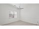 Bright dining area with a modern chandelier, window, and clean, neutral walls at 701 Cupcake Ct, Mcdonough, GA 30252