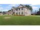 Expansive two-story home featuring a well-manicured lawn and convenient side-entry garage at 701 Cupcake Ct, Mcdonough, GA 30252
