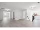 Upstairs hallway featuring wood floors and white trim at 701 Cupcake Ct, Mcdonough, GA 30252