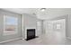 Inviting living room with fireplace, windows, and neutral color scheme at 701 Cupcake Ct, Mcdonough, GA 30252