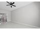 Spacious living room with neutral walls, tile floors and a ceiling fan at 701 Cupcake Ct, Mcdonough, GA 30252