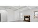 Bright living room with coffered ceiling and brick fireplace, filled with natural light from large windows at 701 Cupcake Ct, Mcdonough, GA 30252