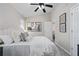 Bedroom featuring a plush bed, white bedding, soft pillows, and wall art at 735 Ponce De Leon Pl Ne, Atlanta, GA 30306