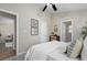 Comfortable bedroom with wall art, a decorative dresser, and two entryways at 735 Ponce De Leon Ne Pl, Atlanta, GA 30306