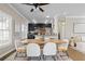 Spacious dining area boasts large windows, modern lighting, and connects to the living area at 735 Ponce De Leon Pl Ne, Atlanta, GA 30306