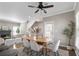 Inviting dining space flows to living area with fireplace and offers natural light and a modern design at 735 Ponce De Leon Pl Ne, Atlanta, GA 30306
