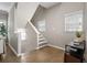 Bright foyer features wood floors, natural light, and access to the upper levels at 735 Ponce De Leon Pl Ne, Atlanta, GA 30306
