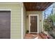 Welcoming front door with brick pathway, potted plants, and an overhead porch at 735 Ponce De Leon Pl Ne, Atlanta, GA 30306