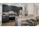 Stylish kitchen features granite countertops, stainless steel appliances, and breakfast bar with seating at 735 Ponce De Leon Pl Ne, Atlanta, GA 30306