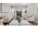 Cozy living room boasts a fireplace, soft natural light, and an inviting layout at 735 Ponce De Leon Pl Ne, Atlanta, GA 30306