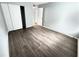 Bedroom featuring wood-look flooring and spacious closet at 925 Seasons Pkwy, Norcross, GA 30093
