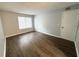 Bedroom with wood-look flooring and neutral paint at 925 Seasons Pkwy, Norcross, GA 30093