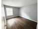 Bedroom featuring modern floors and a bright window for natural lighting at 925 Seasons Pkwy, Norcross, GA 30093