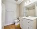 Bathroom featuring a vanity with white cabinets, a mirror, and a shower/tub combo at 1150 Collier Nw Rd # J11, Atlanta, GA 30318