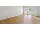 Bedroom featuring wood-look flooring and sliding doors to a balcony at 1150 Collier Nw Rd # J11, Atlanta, GA 30318