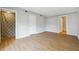 Bright bedroom with wood-look flooring, en-suite bath and a closet offer great storage at 1150 Collier Nw Rd # J11, Atlanta, GA 30318
