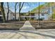 Attractive apartment complex exterior with mature trees and landscaped grounds at 1150 Collier Nw Rd # J11, Atlanta, GA 30318