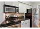 Well-equipped kitchen with stainless steel appliances and sleek countertops at 1150 Collier Nw Rd # J11, Atlanta, GA 30318