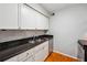 Updated kitchen with granite countertops, stainless steel appliances, and subway tile backsplash at 1150 Collier Nw Rd # J11, Atlanta, GA 30318