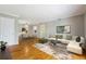 Spacious living room with hardwood floors and an open dining area at 1150 Collier Nw Rd # J11, Atlanta, GA 30318