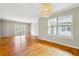 Bright living room with hardwood floors, natural light, and a modern light fixture at 1150 Collier Nw Rd # J11, Atlanta, GA 30318