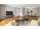 Open-concept living and dining room with hardwood floors and neutral decor at 1150 Collier Nw Rd # J11, Atlanta, GA 30318