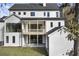 Exterior rear view of a white two-story home with a covered back porch and green backyard at 128 Owens Mill Pl, Canton, GA 30115