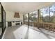 Covered back porch with an outdoor kitchen and built-in grill at 128 Owens Mill Pl, Canton, GA 30115
