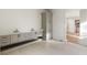 Bright bathroom with double vanity, white marble counters, and tiled floor at 128 Owens Mill Pl, Canton, GA 30115