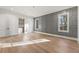 Bedroom featuring hardwood floors, lots of natural light, and stylish wainscoting accent wall at 128 Owens Mill Pl, Canton, GA 30115