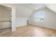 Bright bonus room with hardwood floors, window, and access to kitchenette, perfect for guests at 128 Owens Mill Pl, Canton, GA 30115