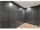 Floor-to-ceiling custom gray cabinets featuring recessed panel doors and brass hardware for optimal storage solutions at 128 Owens Mill Pl, Canton, GA 30115